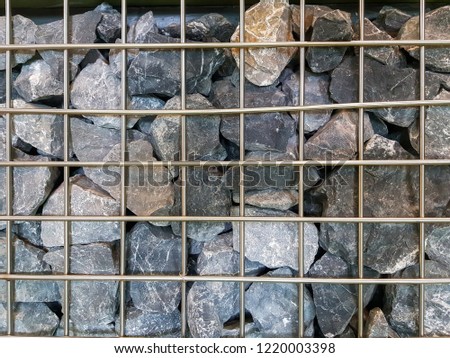 Variety Rocks wall is stacked and Blocked by steel grate to prevent avalanches.