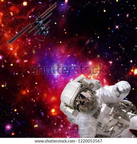 Astronaut flies in space. The elements of this image furnished by NASA.
