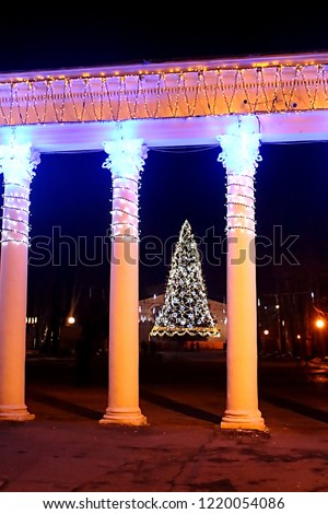 Entrance to Gorkyi park with New year decorations and Christmas tree, Vinnytsia, Ukraine
