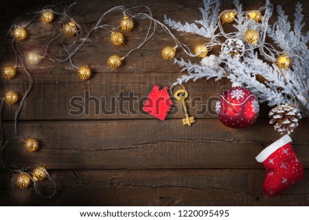 Christmas wooden background new year toys, gifts, fir tree in the snow. Symbol of house.