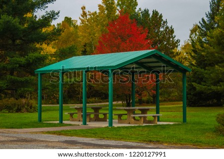 Green shelter for tourists in recreational area in the middle of colorful forest, Ontario, Canada