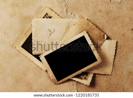 Vintage background with old blank photo frame texture