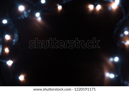Christmas garland closeup on wooden background