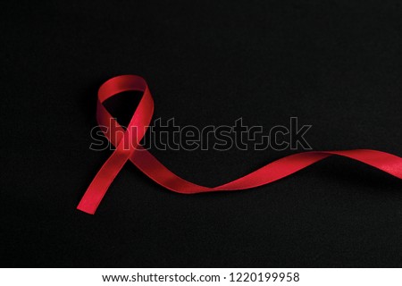 Red Ribbon. Aids Awareness. Royalty-Free Stock Photo #1220199958