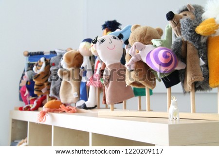 Funny puppets in a kindergarten classroom. Royalty-Free Stock Photo #1220209117