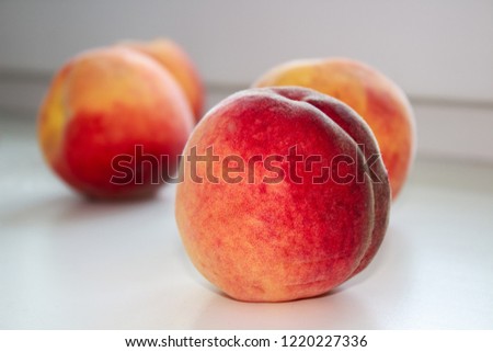 Three tasty peaches