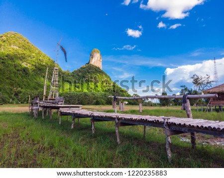 Khao Aoktalu or The Hole Moutain with wooden bridge,  landmark in south of Thailand 