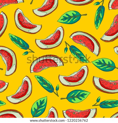 Seamless yellow background with the pattern of red grapefruit for fresh juice. Slices of grapefruit. Green leaves of a tree