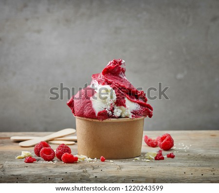 raspberry and white chocolate ice cream in paper cup