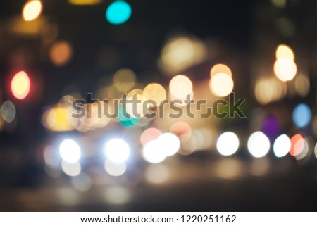 Defocused Background of Evening City Night Life with Car Traffic Lights