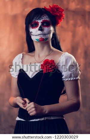 Halloween picture of woman with white make-up on her face, sewn on her mouth