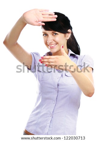 Portrait of a winking young woman making a frame sign with her hands