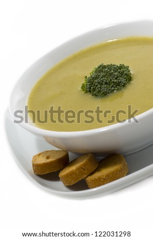 Cream soup with dried crusts isolated on white background