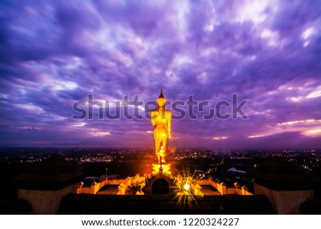 Great Golden Buddha statue at the"Wat Phra That Kao Noi" , Nan province, Thailand  with sky  Twilight time  .
