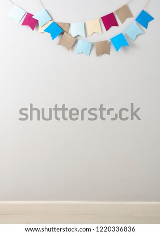 Pastel bunting paper cut on Pastel bunting paper cut on Bright gray wall backgroun