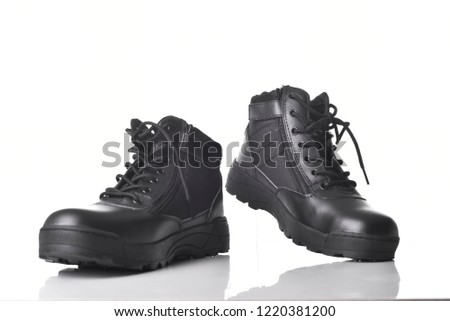 Military leather boots isolated on white background