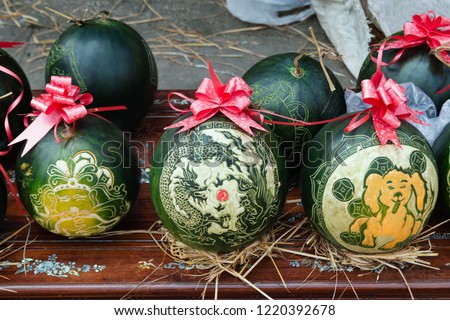 Watermelons with festive engraving on Eve of Vietnamese New Year. Hue, Vietnam.