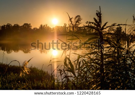 sunset on the lake. reflection