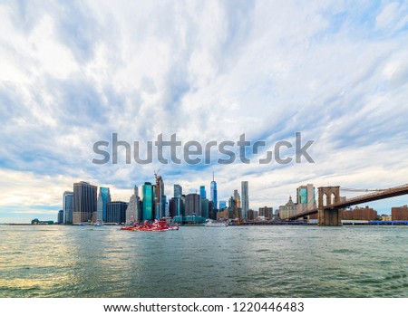 Manhattan panoramic skyline with Brooklyn Bridge. New York City, USA. Office buildings and skyscrapers at Lower Manhattan (Downtown Manhattan).
