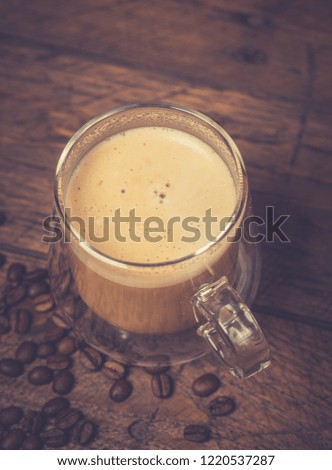 Cup of Cappuccino on wooden vintage table