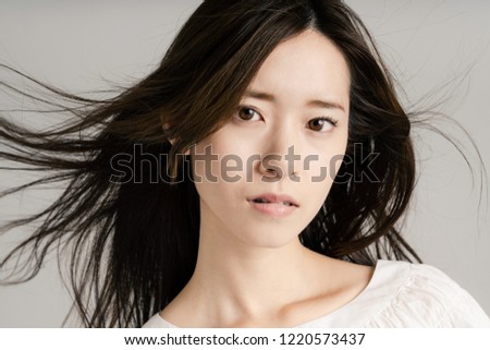 Hair care concept of a young asian girl.