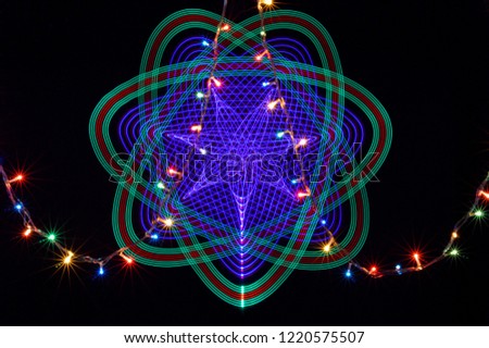 pattern light painting, long exposure photography with led lights and Christmas lights on black background.