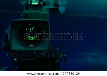 Close-up of a Television Camera lens in a studio environment. Writing gap