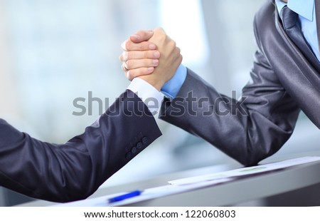Two businessmen press hands each other on a forward background