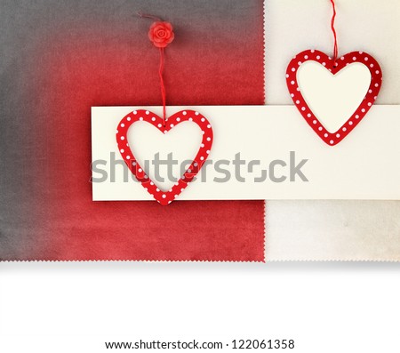 Heart ornament hanging on vintage fabric background