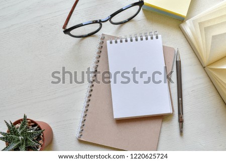 Top view white wooden table, Concept note diary and business in free time with copy space