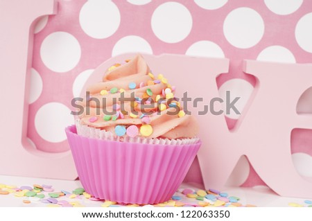Pink cupcake wit sprinkles