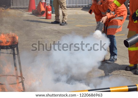 Fire training. People Fire drills. Practice to use fire extinguishers. 