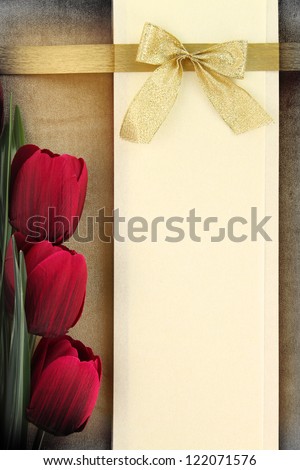 Empty banner and red tulips on vintage background. Mother day concept