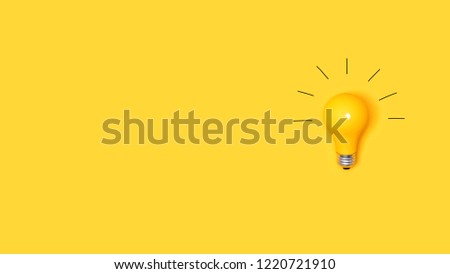 Idea light bulb on a vivid yellow background