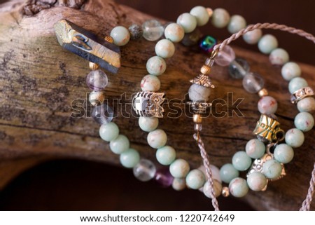 Natural gemstone beads bracelets on wooden background
