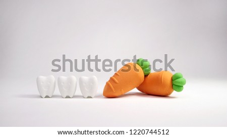 Smile Tooth Model with Carrot Model ,vegetable is a great way to keep your teeth healthy 