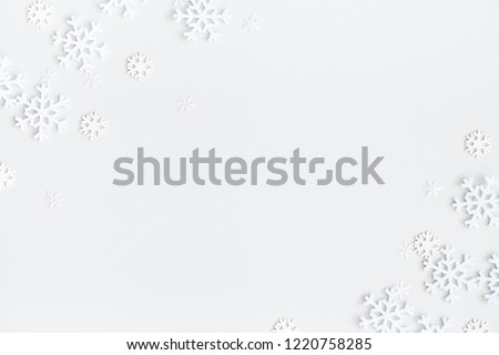 Christmas composition. Christmas frame made of snowflakes on pastel gray background. Winter concept. Flat lay, top view, copy space Royalty-Free Stock Photo #1220758285