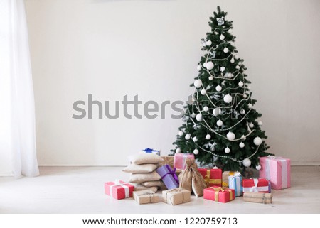 Christmas tree with presents in winter for the new year