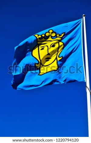 
Sweden flag,  blue flag and yellow woman