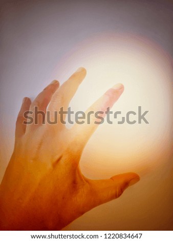 Hands clutching for light on a orange background