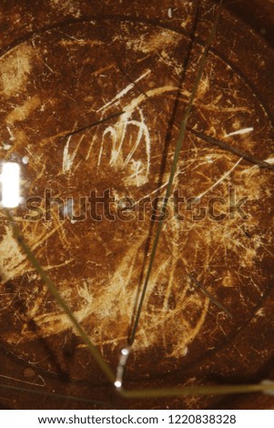 Abstract brown background with different scratches.