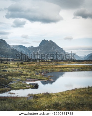 The magical reflections of the mountains in the clear water. During the summer trip to the Norwegian north. Lofoten, Norway.