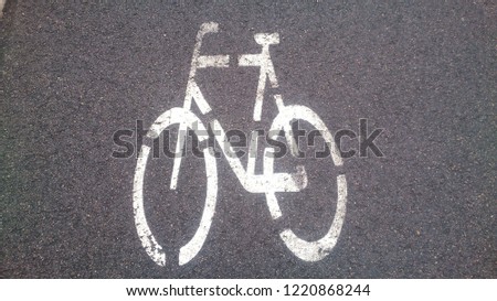 white sports symbols on the asphalt of the sports field