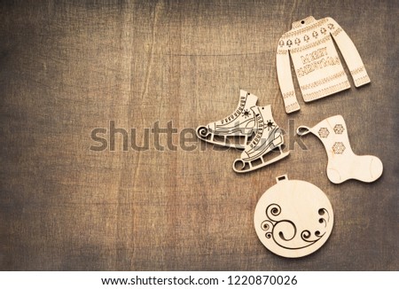 christmas decoration concept with toys at wooden background texture, top view