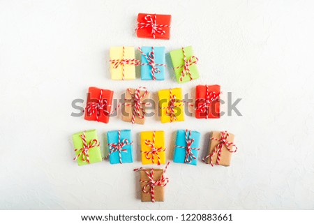 Christmas tree of colorful gift boxes on white background, flat lay style