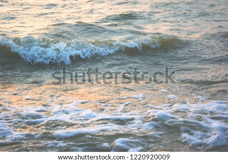 The texture of the waves of water. Out focus. Natural sea stones close-up.  Tourism and travel themed. Crashing wave.Waves in sea splashing waves