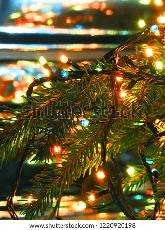 Christmas lights on Christmas tree, decorative garland on blurred background brilliant. New year close-up