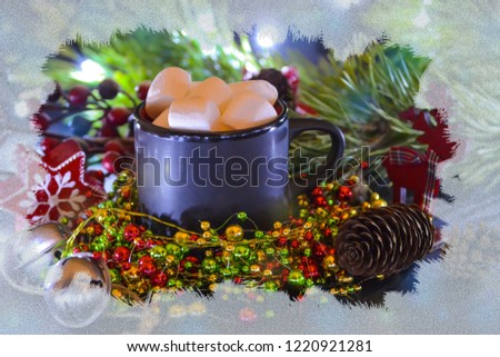Black mug filled with marshmallow on the background of Christmas decorations and spruce branches. The effect of frozen glass. Christmas fantasy