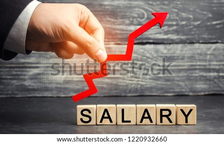 The inscription "salary" and the red arrow up. increase of salary, wage rates. promotion, career growth. raising the standard of living. increase profits and family budget. wealth concept Royalty-Free Stock Photo #1220932660