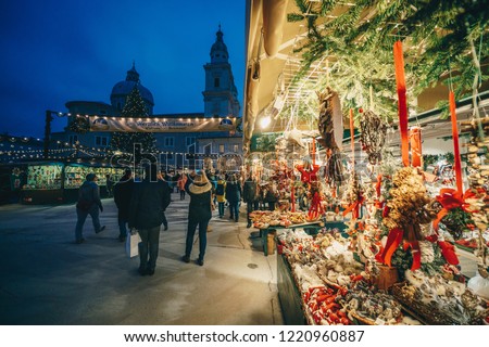 Salzburg Christmas Christkindl advent Market seen trough a Christmas tree branches Royalty-Free Stock Photo #1220960887